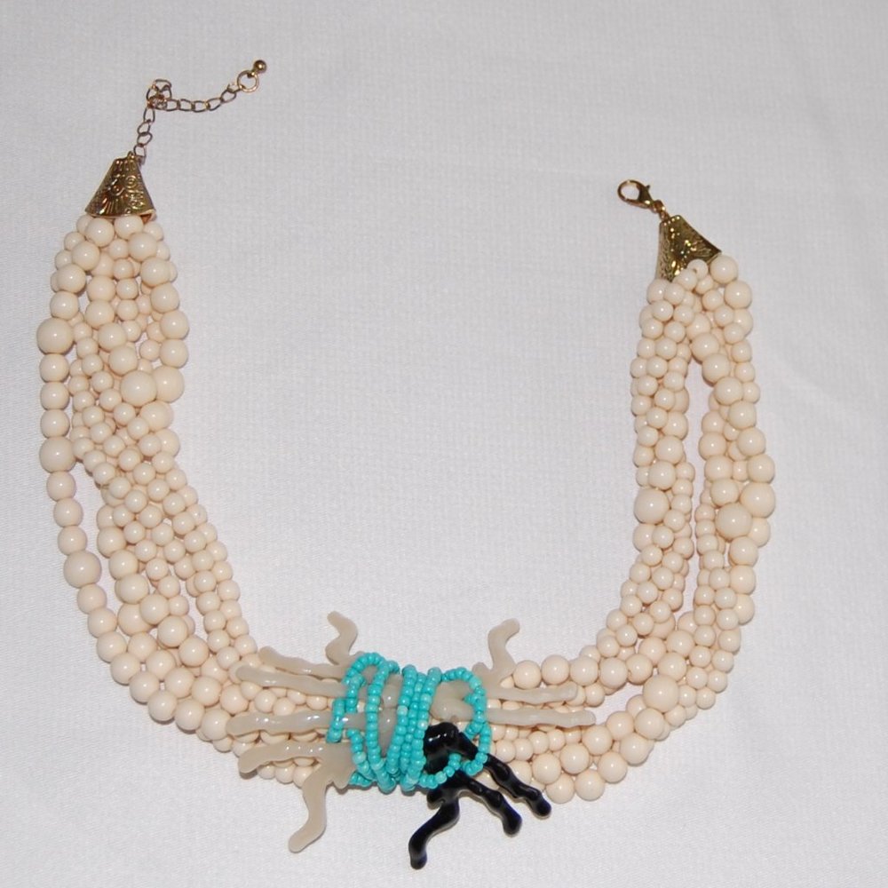 8 Strand Cream Colored Beads With Blue Seed Center Beads &White/Black Center